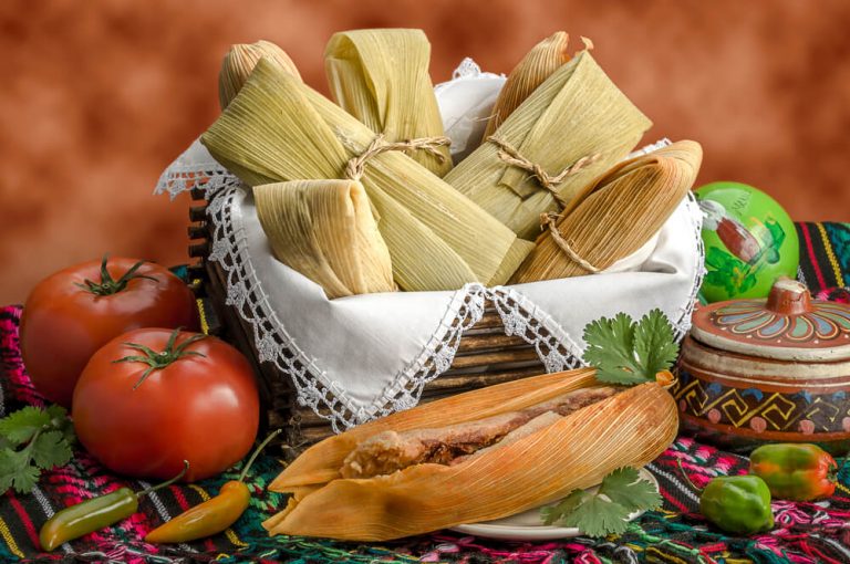 Tamales is being made with different flavors like chicken, pork or beef